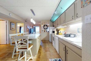 Fridge, microwave, oven, stovetop - Oceanfront condo with balcony, central AC, WiFi, laundry & shared heated pool (Ocean City)