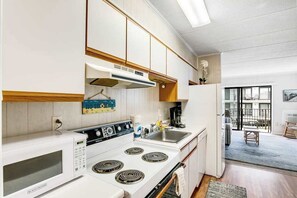Fridge, microwave, oven, stovetop - Cozy condo by the beach w/ private balcony, ocean views, partial AC & free WiFi (Ocean City)