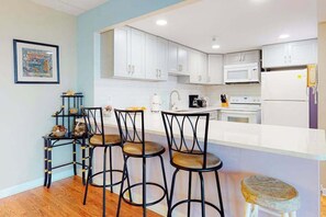 Fridge, microwave, oven, stovetop - Convenient condo with side ocean views, balcony, pools, & tennis (Ocean City)