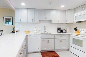 Fridge, microwave, oven, stovetop - Convenient condo with side ocean views, balcony, pools, & tennis (Ocean City)