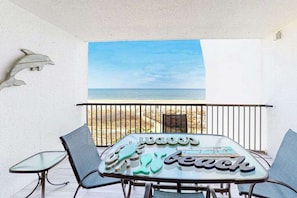 Outdoor dining - Oceanfront Condo with Shaded Balcony, WiFi, Laundry, AC & Shared Pool (Ocean City)