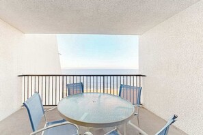 Outdoor dining - Oceanfront Condo with a Shaded Balcony, AC, WiFi & Shared Outdoor Pool (Ocean City)