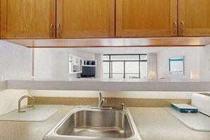 Fridge, microwave, oven, stovetop - Oceanfront Condo with Balcony, Central AC, WiFi, Washer/Dryer, and Shared Pool (Ocean City)