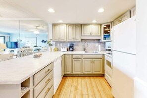 Fridge, microwave, oven, stovetop - 1st-floor oceanfront condo close to beach with private balcony, vibrant interior (Ocean City)