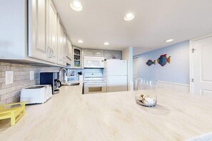 Fridge, microwave, oven, stovetop - 1st-floor oceanfront condo close to beach with private balcony, vibrant interior (Ocean City)