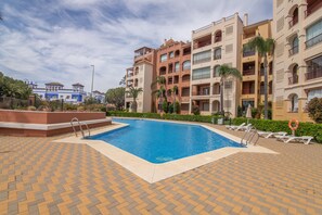 Pool - Isla Canela Apartment with Shared Pool, Wi-Fi, and Air Conditioning (Ayamonte)