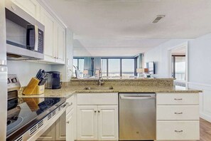 Fridge, microwave, oven, stovetop - Updated, ocean-view condo with balcony, pools, saunas & gym (Ocean City)