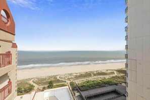 A high-rise building with a view of a beach and ocean. - Terrific Ocean View Condo w/Private W/D, Shared Pools, Beach Access, Free WiFi (Ocean City)