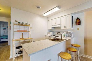 Fridge, microwave, oven, stovetop - Condo Next to Northside Park w/ AC, Washer/Dryer, Balcony & Shared Pool (Ocean City)