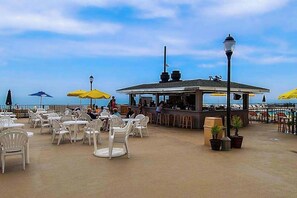 Outdoor dining - Oceanfront Condo on the Beach with Balcony, AC, WiFi & Shared Pools/Hot Tub (Ocean City)