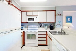 Fridge, microwave, oven, stovetop - Canal-Front Condo w/ Water Views, Balcony, WiFi, AC, Laundry & Shared Pool (Ocean City)