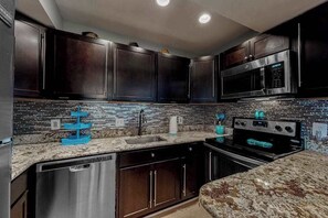 Fridge, microwave, oven, stovetop - Updated waterfront condo with balcony, pools, game room, sauna & gym (Ocean City)