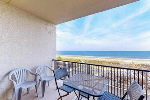 Outdoor dining - Oceanfront condo with balcony, AC, pool, & W/D (Ocean City)