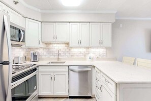 Fridge, microwave, oven, stovetop - Updated Beachfront Condo w/Water View, Balcony, AC & Hot Tub (Ocean City)