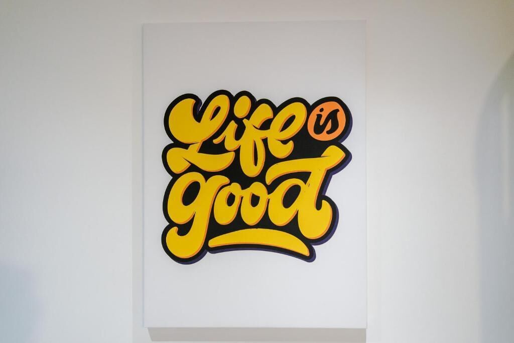 A wall with a graphic that says 'life is good.'