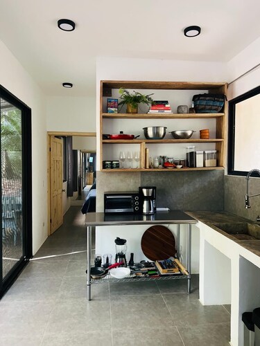 New house on a Luscious Acre 5 min drive from beach