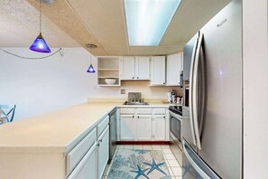 Fridge, microwave, oven, stovetop - Top-floor, corner condo steps to beach with balcony & ocean views (Ocean City)