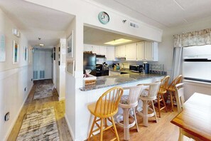 Fridge, microwave, oven, stovetop - Waterfront condo with effortless beach access, private balcony, games, W/D, & AC (Ocean City)
