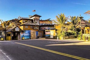 A multi-story building with a sign reading 'Seaviews' and a flag on top. - Dog-Friendly Beach House - Fast WiFi, Central AC, Gas Fireplace & Washer/Dryer (Ocean City)