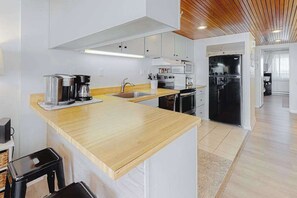Fridge, microwave, oven, stovetop - Beach- & oceanfront condo with balcony, washer/dryer, pool, & views (Ocean City)