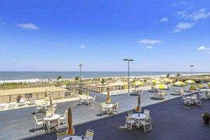 Outdoor dining - Spacious & bright beachfront condo with ocean views from balcony & pool (Ocean City)