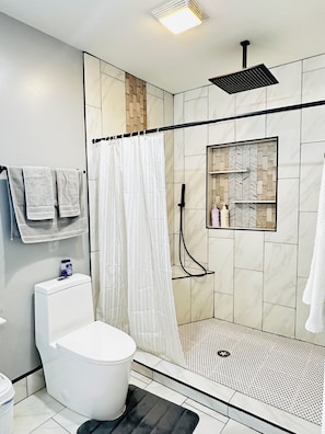 Shower, hair dryer, towels, soap