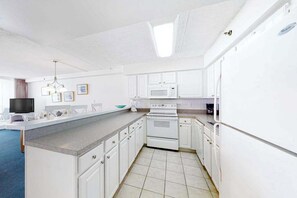 Fridge, microwave, oven, stovetop - Waterfront condo with balcony, views, pools, gym, & sauna (Ocean City)
