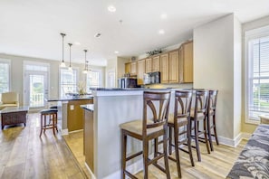 Fridge, microwave, oven, stovetop - Contemporary townhome with 21-foot dock, 4 decks, WiFi, AC & shared pool (West Ocean City)