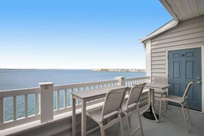 Outdoor dining - Bayfront third-floor condo with sunset views, fast WiFi, and walkable location (Ocean City)