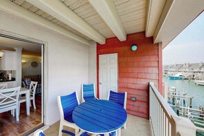 Outdoor dining - Third-floor bayfront condo with fast WiFi & balcony with views - near boardwalk (Ocean City)