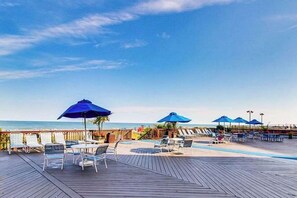 Outdoor dining - Upscale ocean view condo with pool access & balcony - walk to beach, restaurants (Ocean City)