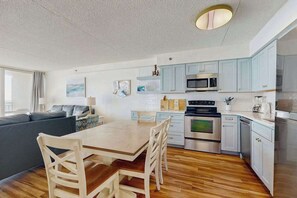 Fridge, microwave, oven, stovetop - Oceanfront condo with pool, hot tub, fitness room, sauna, deck, & ocean view (Ocean City)
