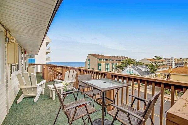 Outdoor dining - Beach & Bright Oceanfront Condo W/ Fast WiFi, Patio, Beach Access & More (Ocean City)