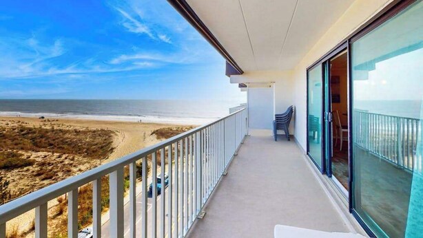 A balcony with a view of the beach and ocean. - Ocean Place 519 (Ocean City)
