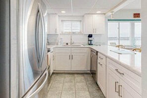 Fridge, microwave, oven, stovetop - Bayfront Condo with Lovely Sunset Views, Balcony, AC, W/D & Shared Pool (Ocean City)