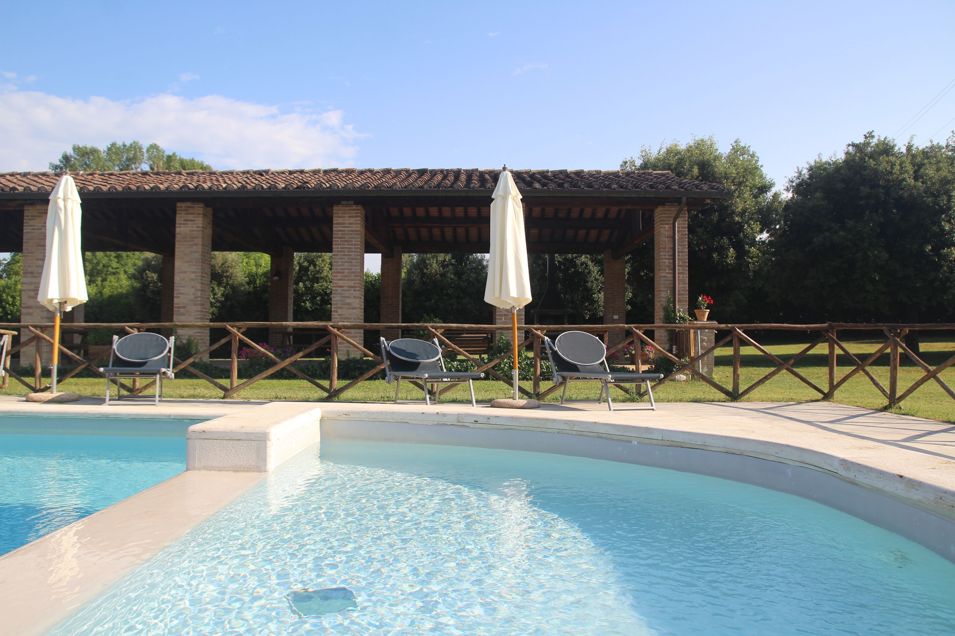 Seasonal outdoor pool, open 9:00 AM to 7:00 PM, pool umbrellas