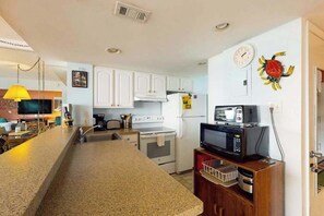 Fridge, microwave, oven, stovetop - Joyful beachfront condo with balcony, views, pools, gym, game room & tennis (Ocean City)