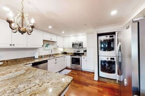 Fridge, microwave, oven, stovetop - Updated waterfront condo with washer/dryer, central AC, & seasonal pool (Ocean City)