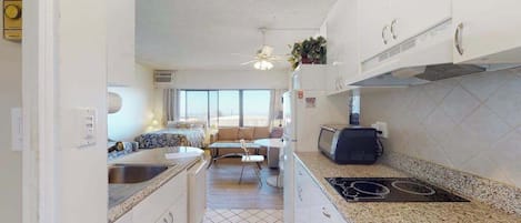 Fridge, microwave, stovetop, coffee/tea maker