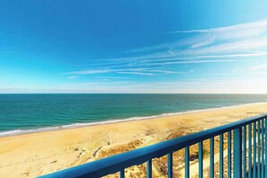 A beach view with a clear sky and calm sea. - Luxury, Oceanfront, condo with indoor pool, saunas, gym, tennis & game room (Ocean City)