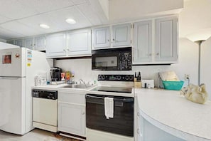 Fridge, microwave, oven, stovetop - Ocean view condo on beach block with balcony, near restaurants and more (Ocean City)
