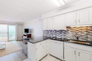Fridge, microwave, oven, stovetop - Breezy beachfront condo with balcony, W/D, hot tub, & full kitchen (Ocean City)