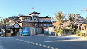 A multi-story building with a sign for 'Seavals' and 'RAVES SINCE 1920'. - Dog-friendly 1st-floor end condo with beach entrance view - steps to the beach (Ocean City)