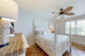 A bedroom with a four-poster bed, a ceiling fan, and a large window with blinds. - Townhome with central AC, washer/dryer, & pool access - close to beach (West Ocean City)