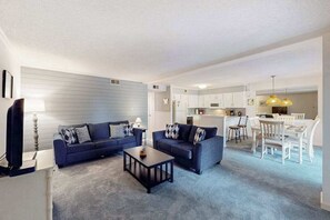 TV, offices - Coastal condo with shared pool, balcony, open layout, internet, W/D, & AC (Ocean City)