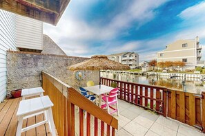 Outdoor dining - Canal-side condo near beach with water view, pool, private deck, & courtyard (Ocean City)