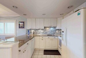 Fridge, microwave, oven, stovetop - Sunny Beach Front Condo w/Beach Access, Private patio, W/D, AC & full kitchen (Ocean City)