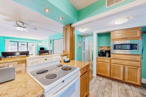 Fridge, microwave, oven, stovetop - Canal view condo with pool & grill access - scenic balcony, open layout, and AC (Ocean City)