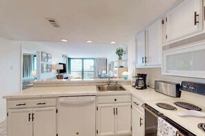 Fridge, microwave, oven, stovetop - Serene oceanfront condo with beach views, pools, gym, tennis & sauna (Ocean City)