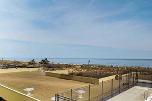Terrace/patio - Sunny oceanfront condo with shared pool & deck, W/D, & direct beach access (Ocean City)